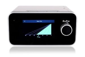 ResPro AC20 Auto CPAP machine displayed on a white background, showing the device front panel with digital display, ramp time settings, and control dial. The image highlights the sleek design of the ResPro sleep therapy device